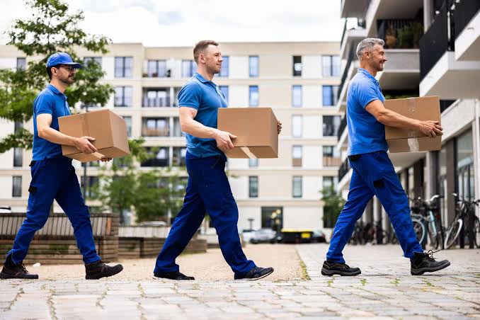 Easy Move team handling packed belongings during an apartment relocation